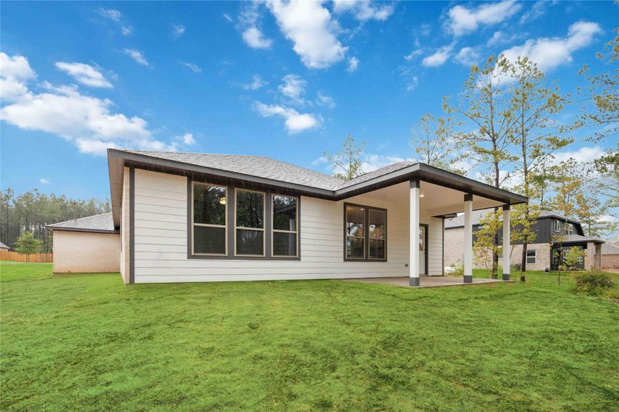Front exterior of a new home in Deer Pines, Conroe, TX, highlighting curb appeal (Image 14).