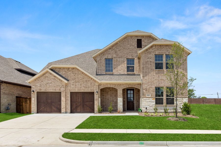 Representative exterior photo of a completed home built from the Kirby by UnionMain Homes in Edgewater, Fate, TX (Image 5). Representative exterior photo of a completed home built from the Kirby by UnionMain Homes in Edgewater, Fate, TX (Image 5).