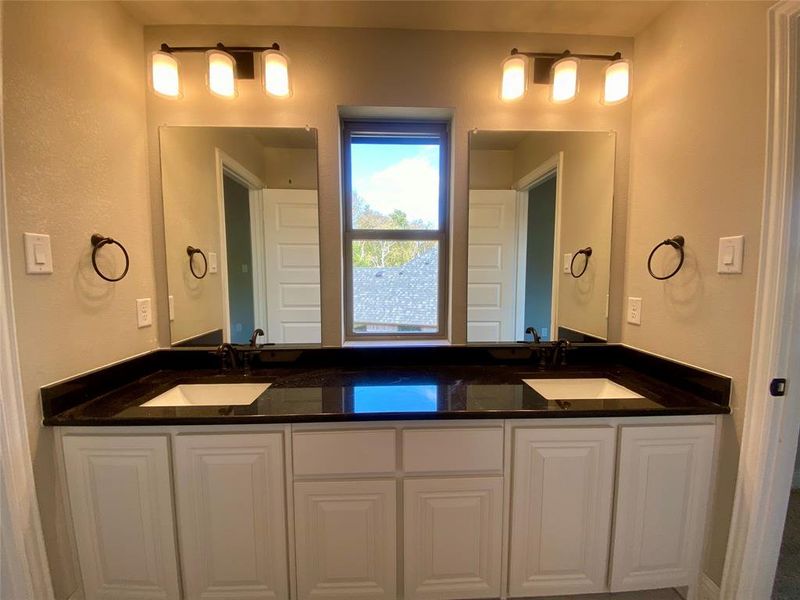 Jack & Jill Bath 4 has separate vanity area with dual sinls & window Jack & Jill Bath 4 has separate vanity area with dual sinls & window