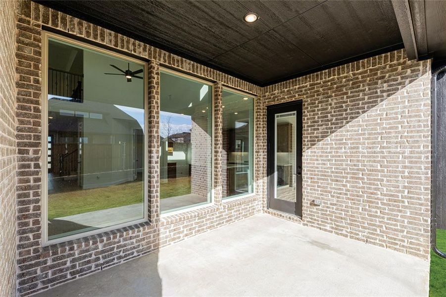 Exterior details and patio area of a home in Creekview Meadows, Pilot Point (Image 26).
