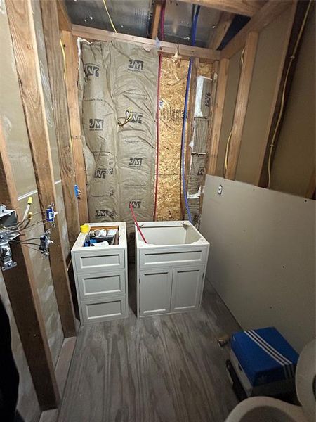 Bathroom featuring toilet and dark wood-style floors