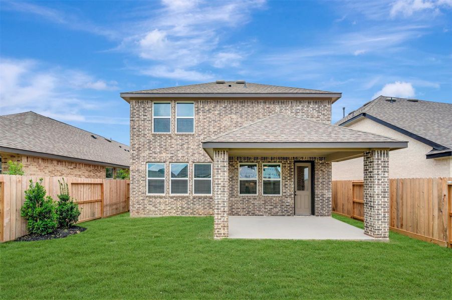 Peaceful backyard with covered patio Peaceful backyard with covered patio