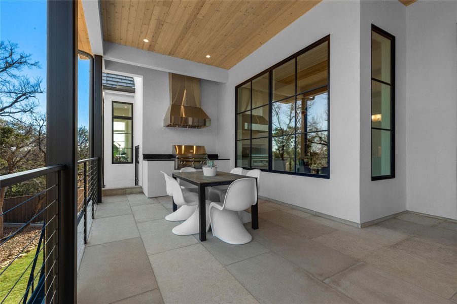 Dining space with wood ceiling and recessed lighting Dining space with wood ceiling and recessed lighting