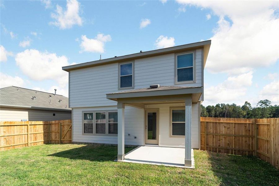 Come and see this spacious backyard with its beautiful covered patio. There is plenty of room for the kids to play and adults to relax!