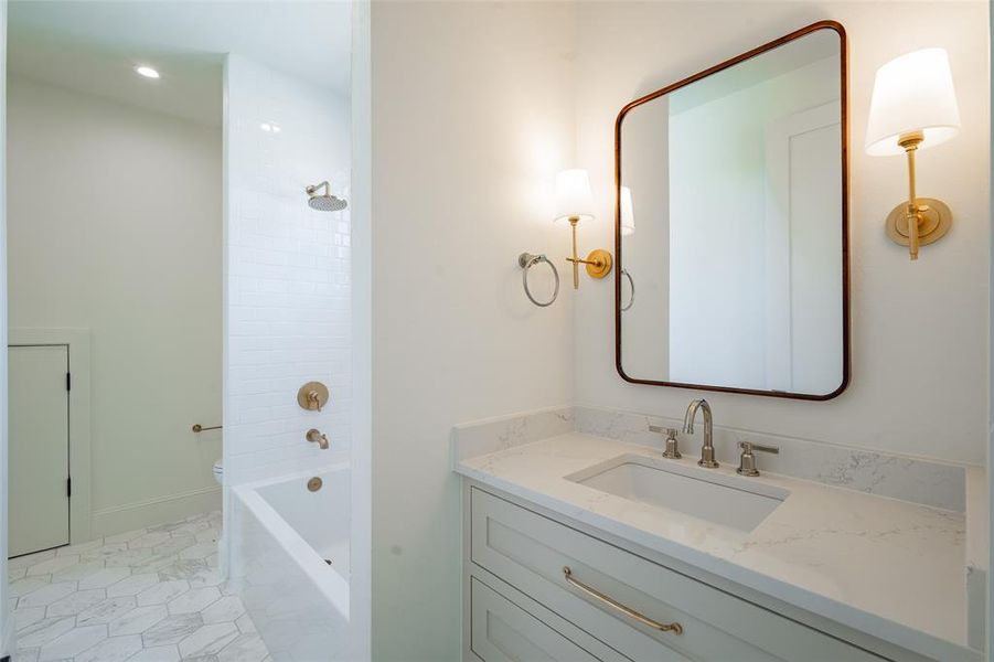 Full bathroom featuring vanity, tile patterned floors, toilet, and shower / bath combination