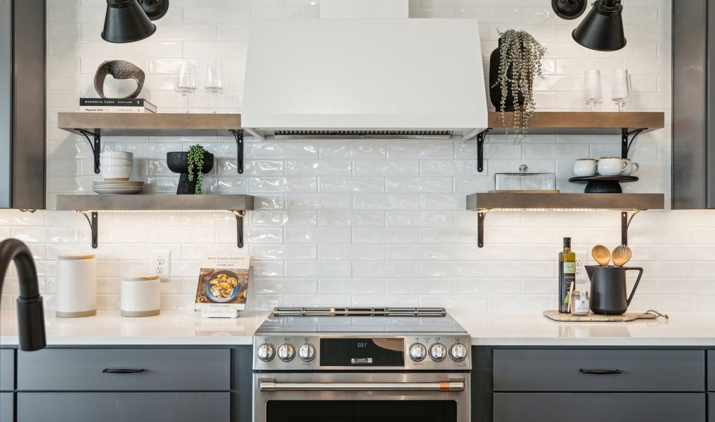 Kitchen with full-height tile backsplash