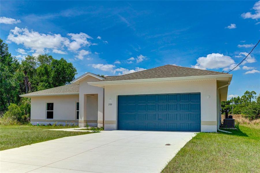 Front exterior of a new home in , North Port, FL, highlighting curb appeal (Image 24).