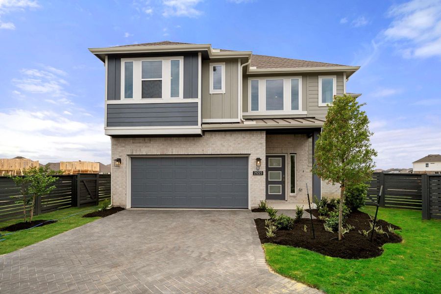 Front exterior of a new home in Bridgeland, Cypress, TX, highlighting curb appeal (Image 18).