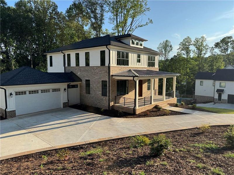 Front exterior of a new home in , Woodstock, GA, highlighting curb appeal (Image 30).