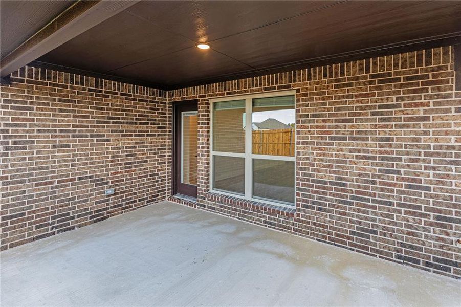 Exterior details and patio area of a home in West Crossing, Anna (Image 4). Exterior details and patio area of a home in West Crossing, Anna (Image 4).