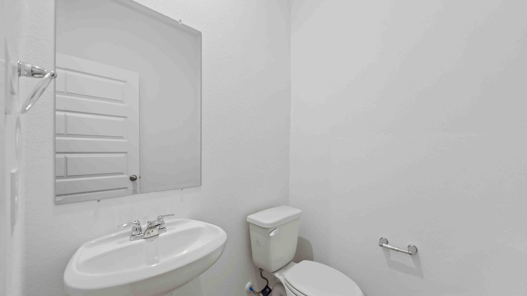 Representative furnished interior of a home built from the Magnolia by D.R. Horton in Grand West, Houston (Image 9).