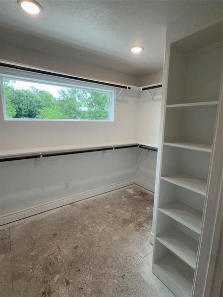 huge walk in primary bedroom closet