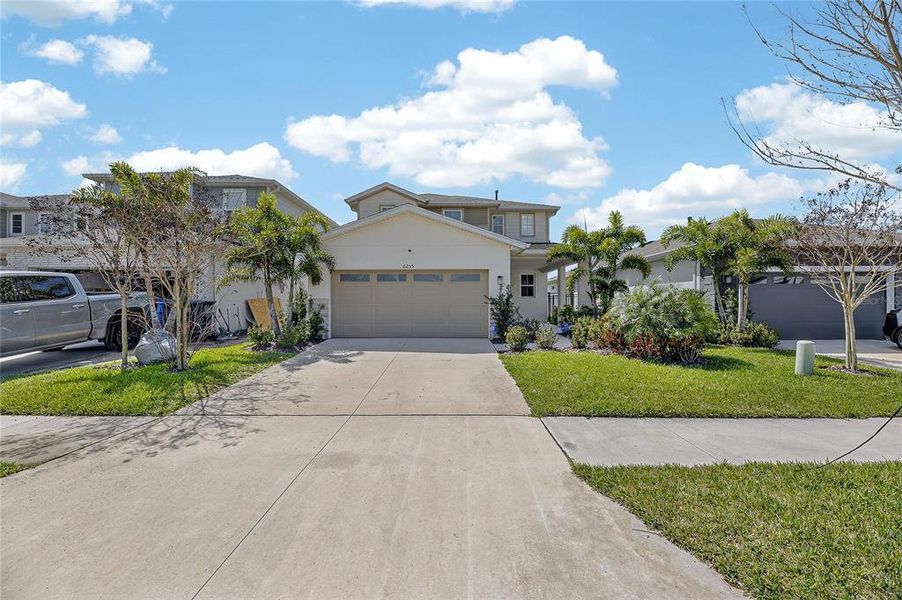 Front exterior of a new home in , Apollo Beach, FL, highlighting curb appeal (Image 25).