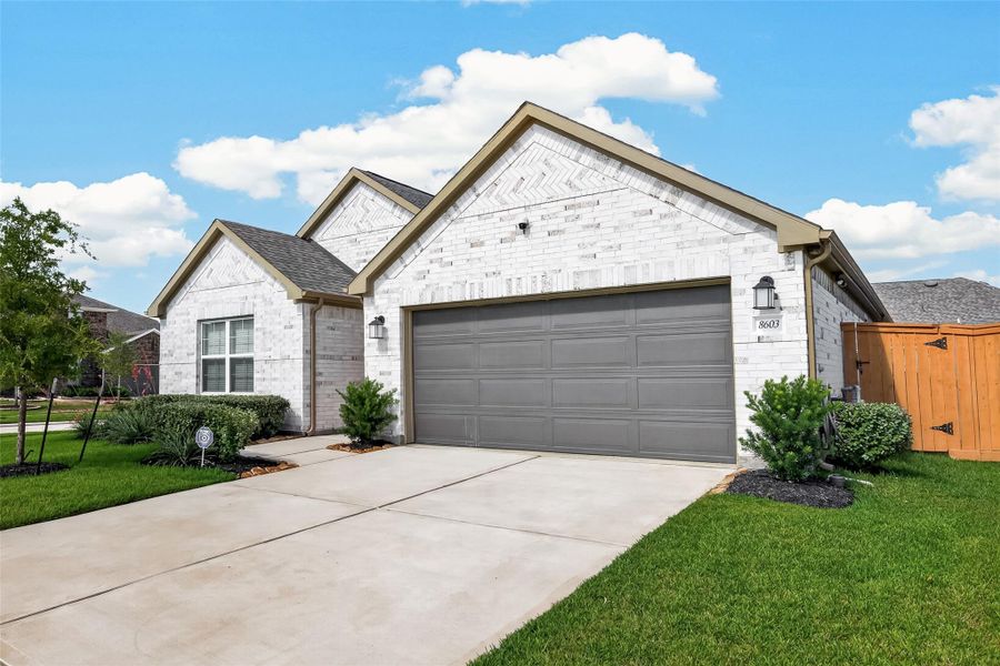 Front exterior of a new home in Marvida, Cypress, TX, highlighting curb appeal (Image 2). Front exterior of a new home in Marvida, Cypress, TX, highlighting curb appeal (Image 2).
