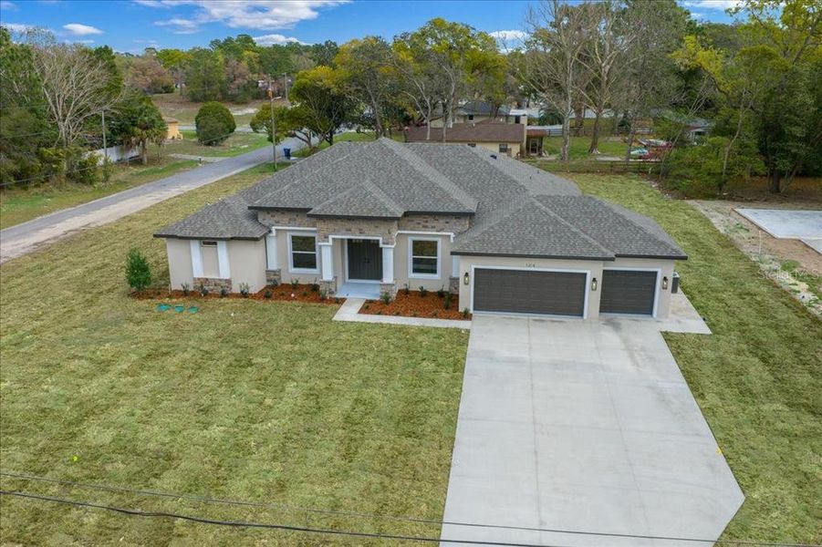 Front exterior of a new home in , Spring Hill, FL, highlighting curb appeal (Image 2). Front exterior of a new home in , Spring Hill, FL, highlighting curb appeal (Image 2).