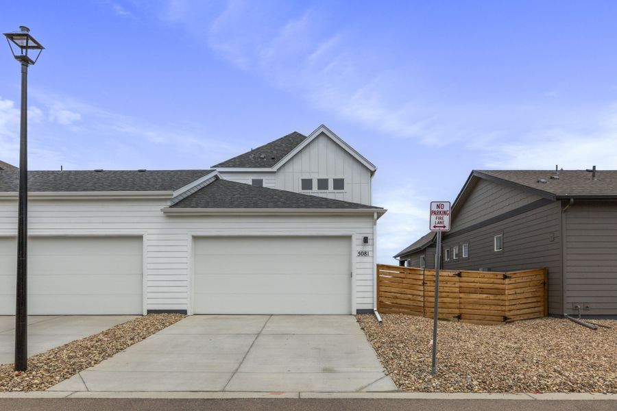 Front exterior of a new home in Trailside on Harmony, Timnath, CO, highlighting curb appeal (Image 2).