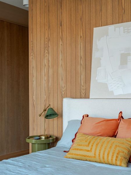 Bedroom with wood walls