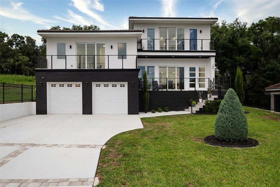 Front exterior of a new home in , Clermont, FL, highlighting curb appeal (Image 28). Front exterior of a new home in , Clermont, FL, highlighting curb appeal (Image 28).