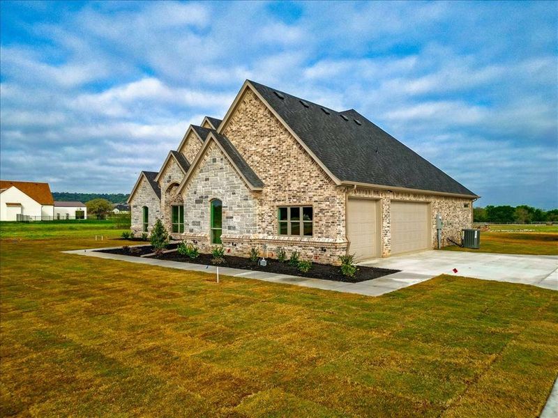 Front exterior of a new home in , Granbury, TX, highlighting curb appeal (Image 23). Front exterior of a new home in , Granbury, TX, highlighting curb appeal (Image 23).