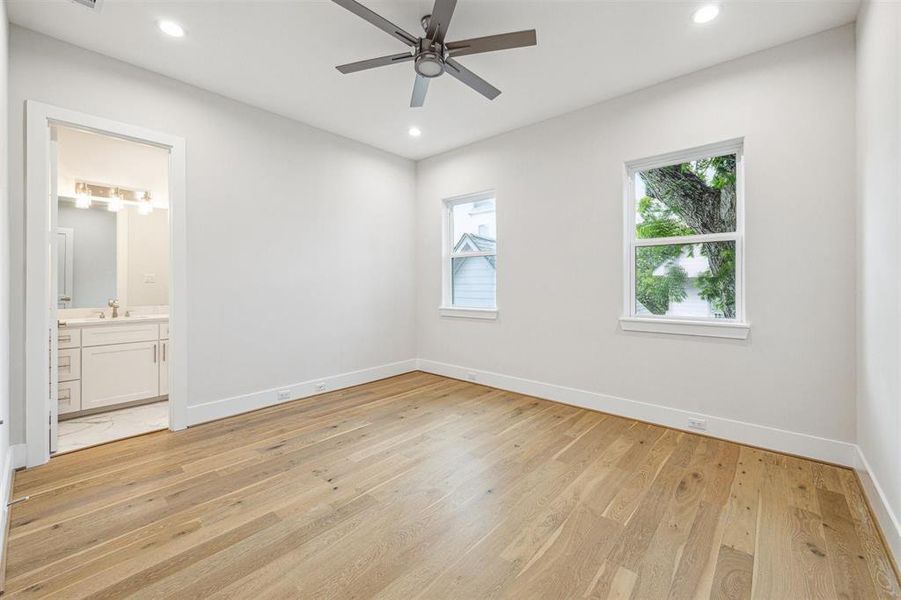 Large secondary bedroom on second floor features full bath and walk-in closet.