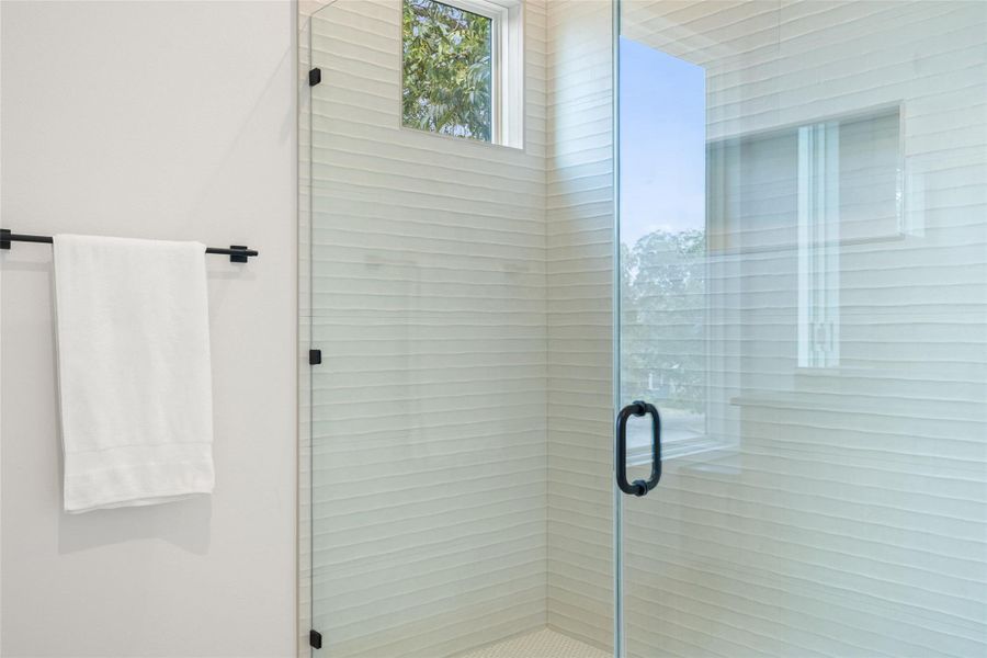 Bathroom featuring a stall shower Bathroom featuring a stall shower