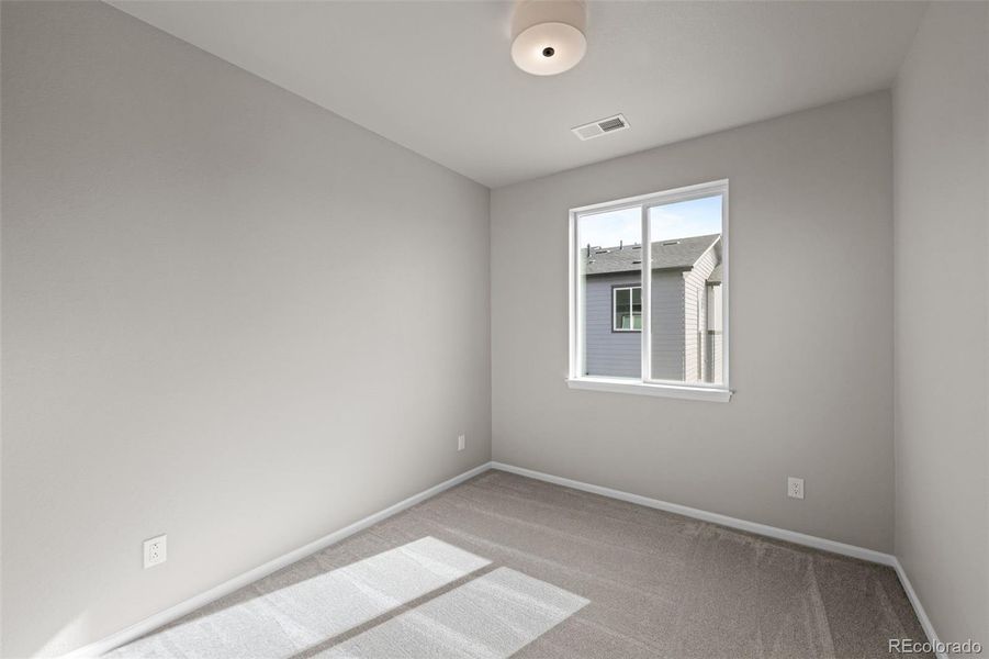 Spacious, unfurnished interior of a new home in Ralston Creek, Arvada (Image 30).