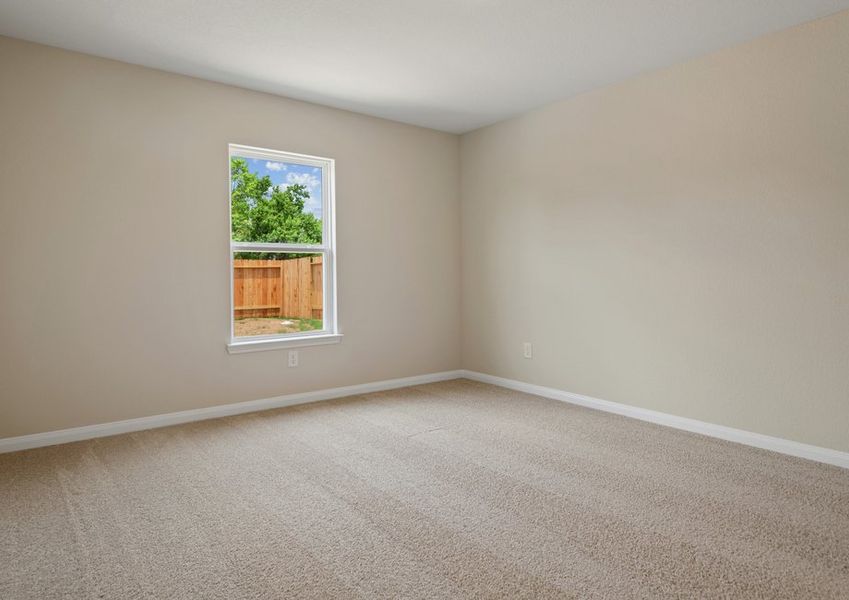 Master bedroom with a large window and ceiling fan light fixture
