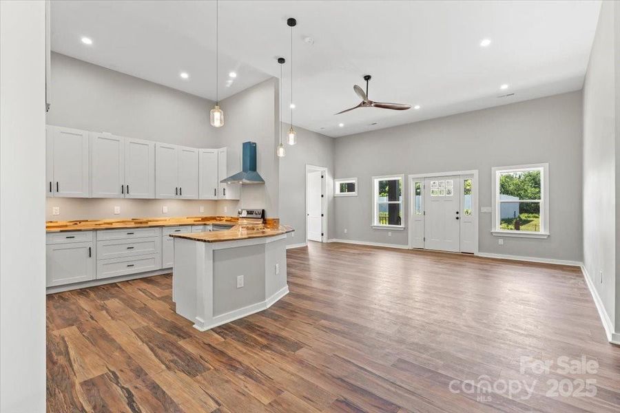 Kitchen opens to common living area while also offering some privacy Kitchen opens to common living area while also offering some privacy