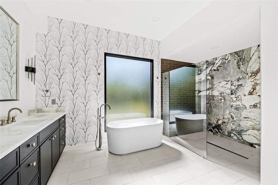 Bathroom with walk in shower, vanity, a soaking tub, light tile patterned flooring, and wallpapered walls