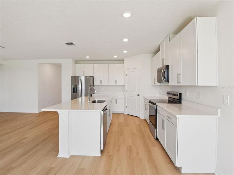 Furnished interior view inside a new home in The Grove at Stuart Crossing - Classic Series, Bartow (Image 3). Furnished interior view inside a new home in The Grove at Stuart Crossing - Classic Series, Bartow (Image 3).