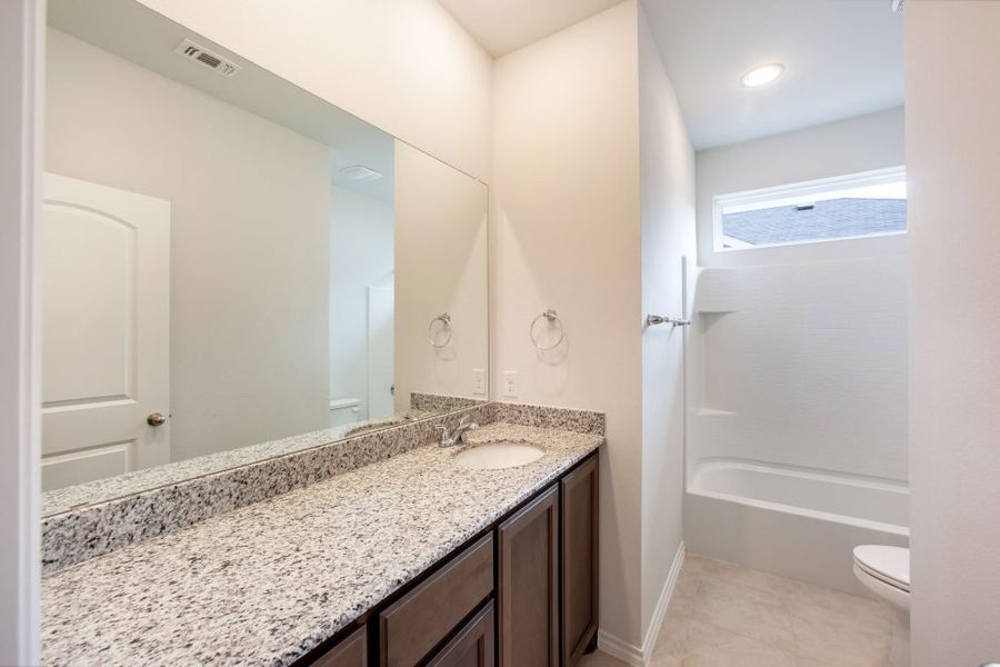 Representative exterior photo of a completed home built from the Wesley by Impression Homes in Heartland, Heartland, TX (Image 20). Representative exterior photo of a completed home built from the Wesley by Impression Homes in Heartland, Heartland, TX (Image 20).