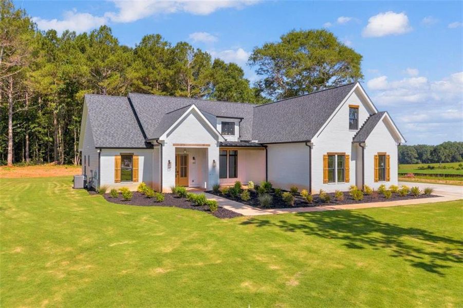 Front exterior of a new home in , Covington, GA, highlighting curb appeal (Image 27). Front exterior of a new home in , Covington, GA, highlighting curb appeal (Image 27).