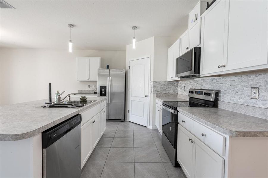 Furnished interior view inside a new home in Poinciana Enclave, Kissimmee (Image 16).