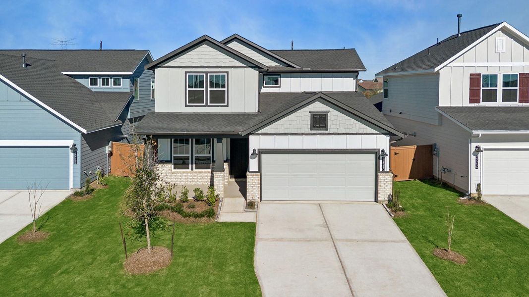 Front exterior of a new home in Elyson, Katy, TX, highlighting curb appeal (Image 21). Front exterior of a new home in Elyson, Katy, TX, highlighting curb appeal (Image 21).