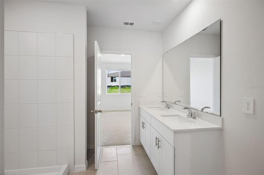 Furnished interior view inside a new home in The Reserve at Van Oaks, Auburndale (Image 13).