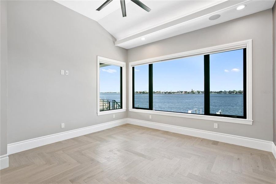 3rd floor 3rd en suite bedroom with expansive windows with Boca Ciega water views