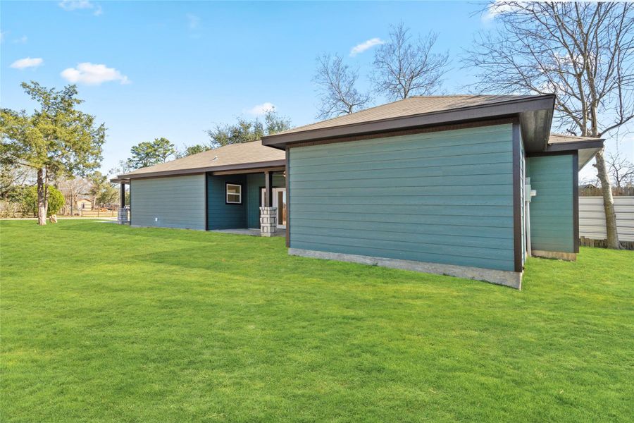 Rear exterior showcasing durable materials and low-maintenance new construction.