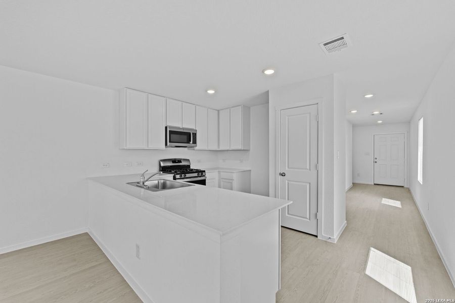 Furnished interior view inside a new home in Spring Grove, St. Hedwig (Image 6).