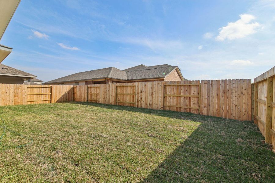 Exterior details and patio area of a home in Landing Meadows - Premier Series, New Caney (Image 18).