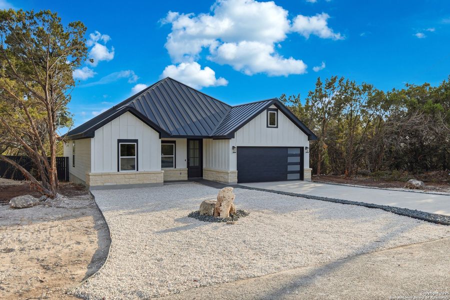 Front exterior of a new home in , Spring Branch, TX, highlighting curb appeal (Image 21). Front exterior of a new home in , Spring Branch, TX, highlighting curb appeal (Image 21).