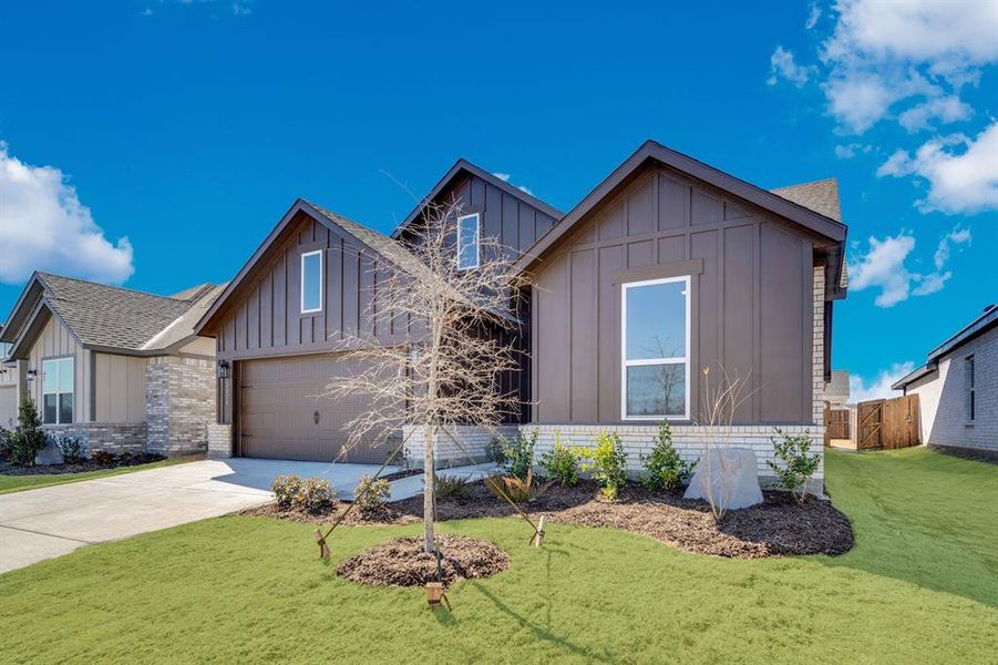 Front exterior of a new home in Hickory Hill, Sherman, TX, highlighting curb appeal (Image 1). Front exterior of a new home in Hickory Hill, Sherman, TX, highlighting curb appeal (Image 1).