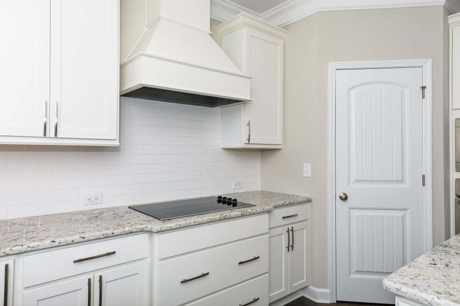 Gourmet kitchen layout with vent hood option.