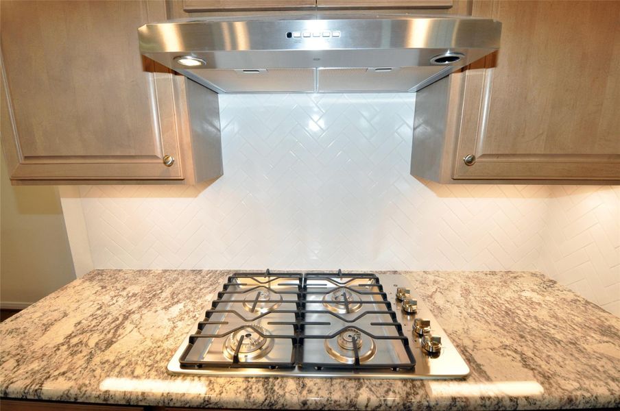 Gas cooktop is vented to the exterior.