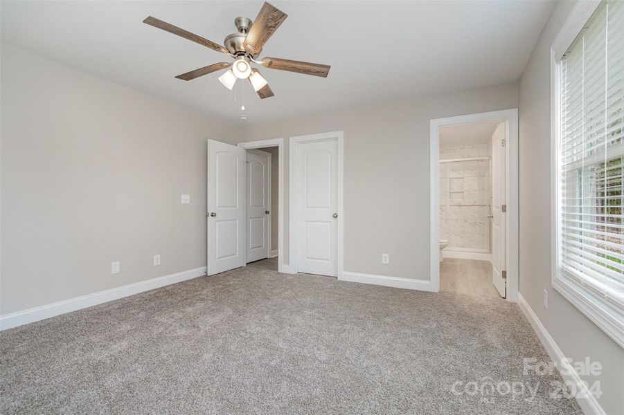 Primary Bedroom with large walk in closet and en suite bathroom.