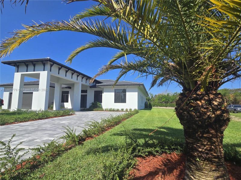 Front exterior of a new home in , Homestead, FL, highlighting curb appeal (Image 29).