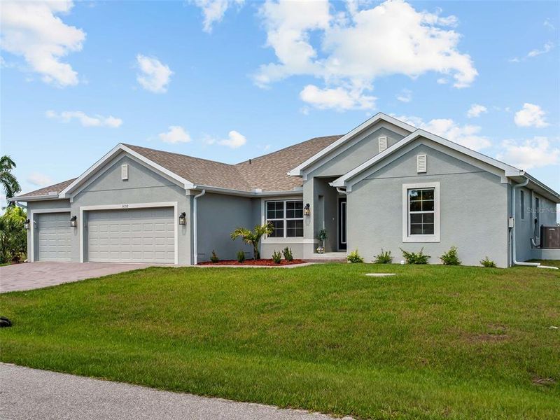 Front exterior of a new home in Port Charlotte, Port Charlotte, FL, highlighting curb appeal (Image 28).