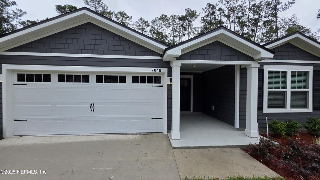 Front exterior of a new home in , Jacksonville, FL, highlighting curb appeal (Image 1).