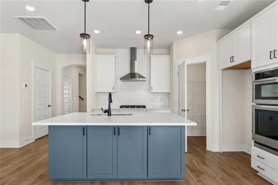 This kitchen features a bright ambiance with moder