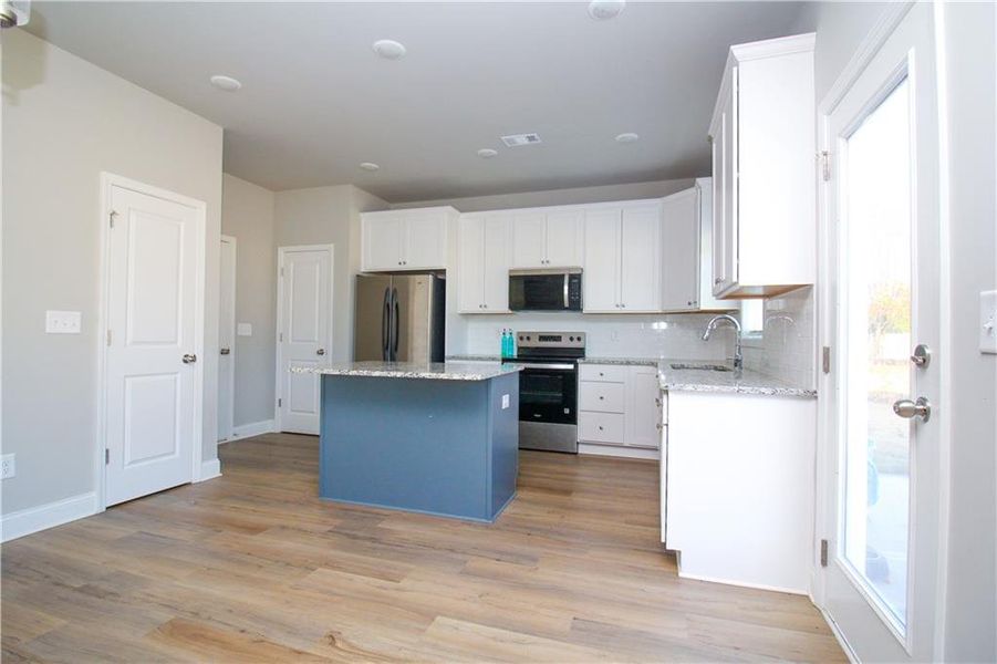 Furnished interior view inside a new home in , Commerce (Image 6).