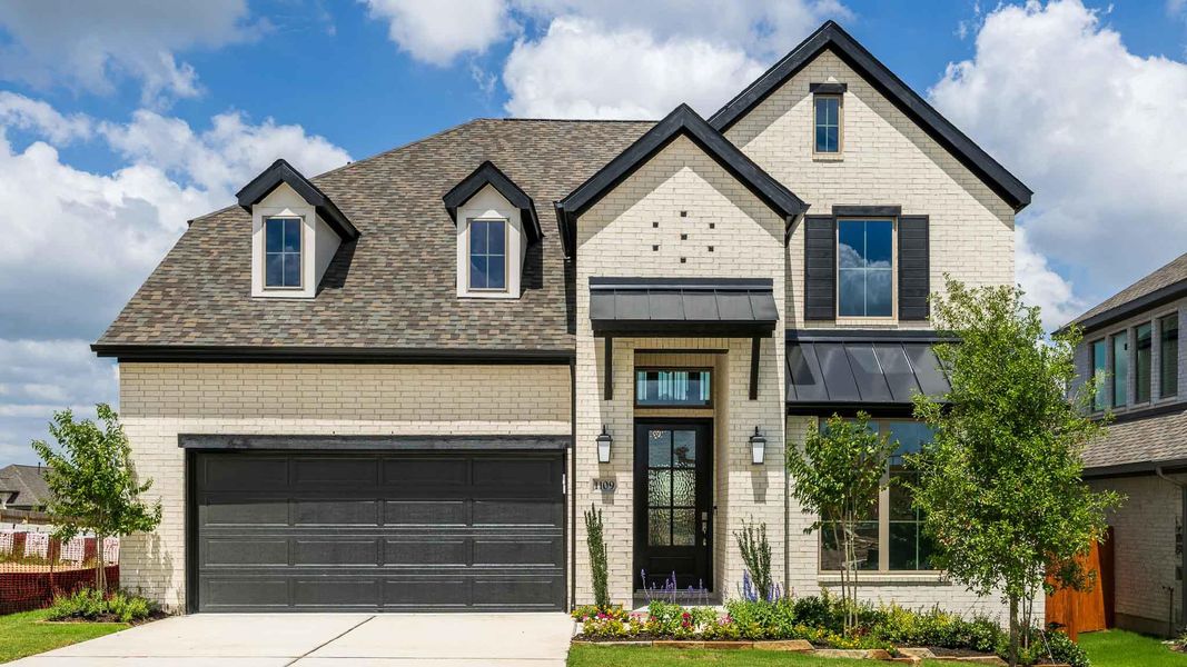Front exterior of a new home in Lariat 50', Liberty Hill, TX, highlighting curb appeal (Image 2). Front exterior of a new home in Lariat 50', Liberty Hill, TX, highlighting curb appeal (Image 2).